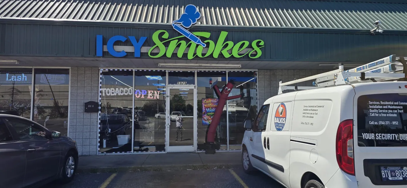 Balkis Cameras van outside Icy Smokes storefront